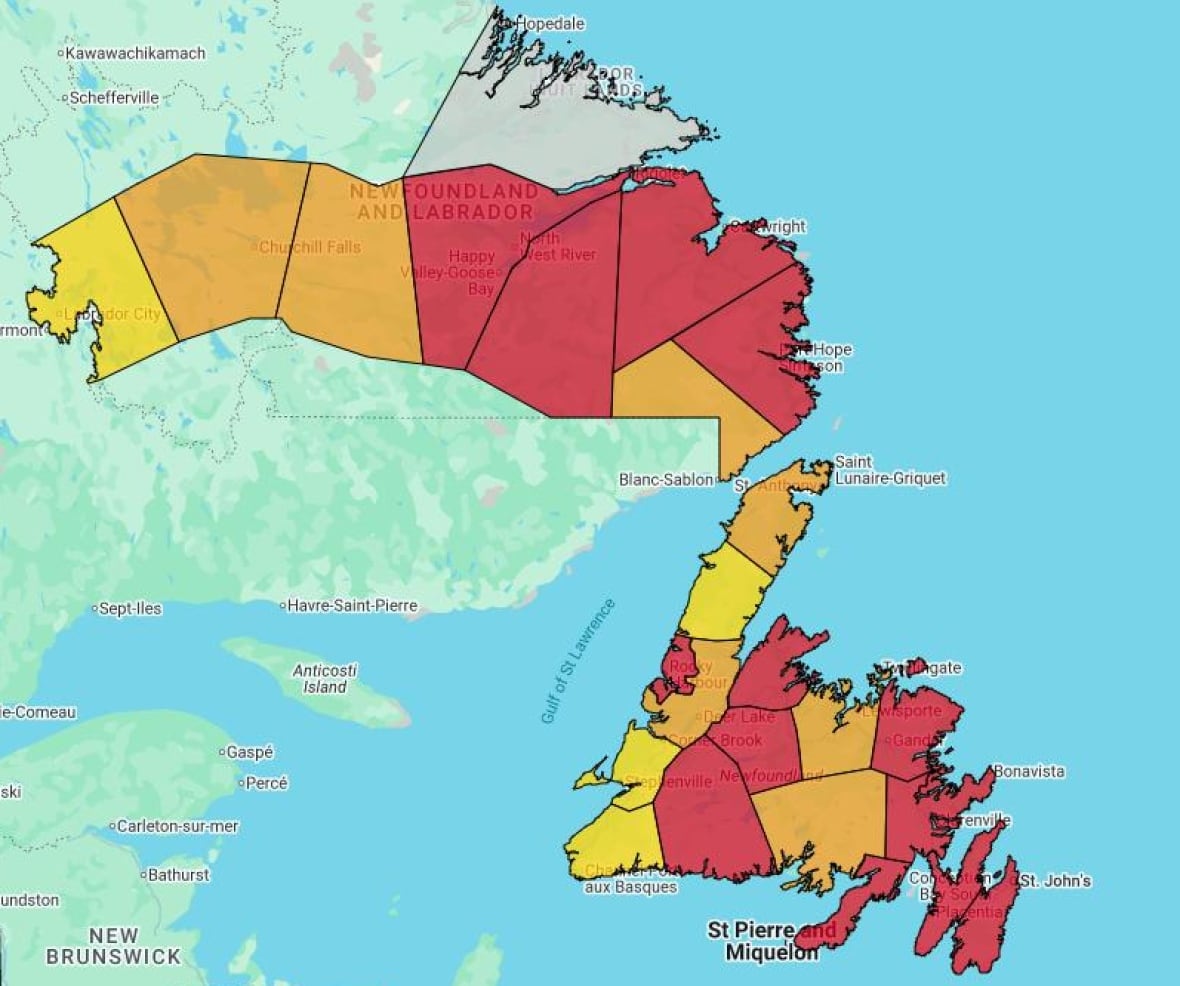 A map of Newfoundland and Labrador is divided into geographical regions. Much of the map is red, indicating an extreme risk of fire. Other sections are oranges and yellow, indicating a high and very high risk risk.