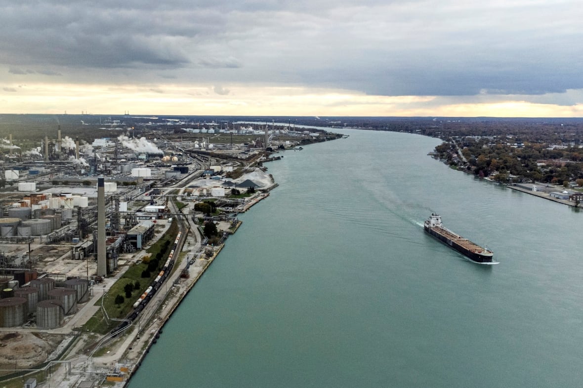 A ship passes the Imperal Oil refinery, one of many facilities in Canada's "Chemical Valley", along the St. Clair River in an aerial photograph in Sarnia, Ontario, Canada November 3, 2021. Picture taken November 3, 2021. 