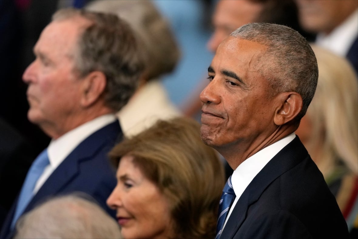 A dark man appears consisting of an organizer who was wearing a suit and tie.