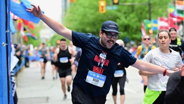 Noah Allison finishing marathon