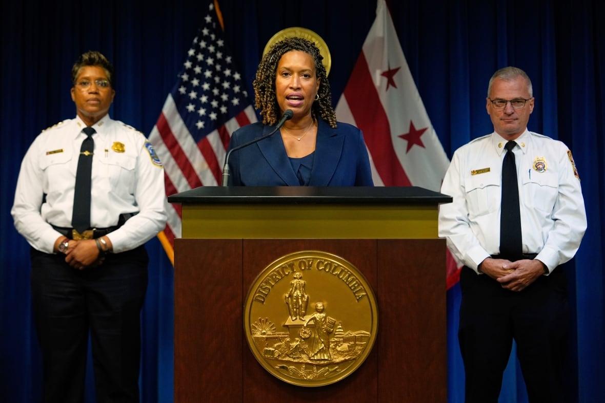 Washington Mayor Muriel Bowser speaks as Metropolitan Police Department Chief Pamela Smith, left, and D.C. Fire and EMS Chief John Donnelly, listen during a news conference on President Donald Trump's plan to place Washington police under federal control and deploy National guard troops to Washington, Monday, Aug. 11, 2025, in Washington.