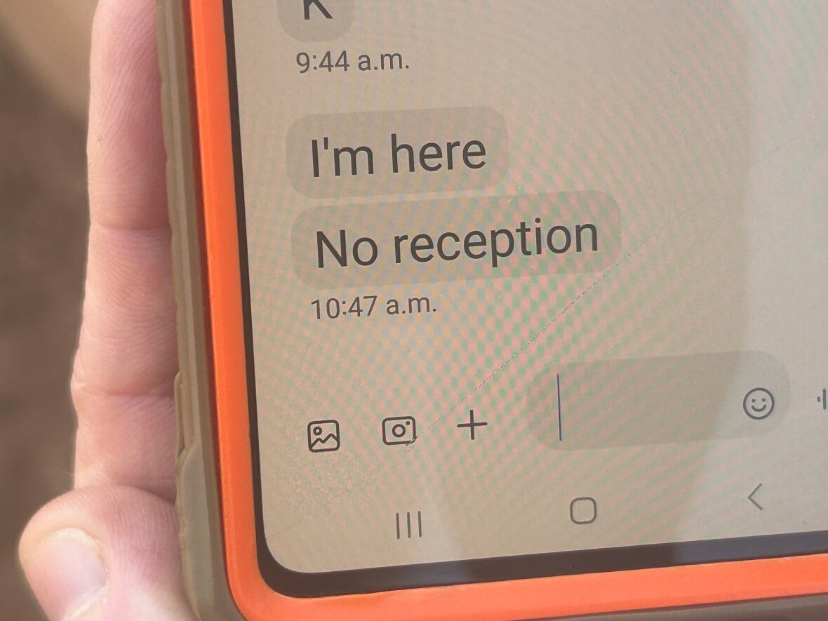 phone message says "I'm here, no reception" 