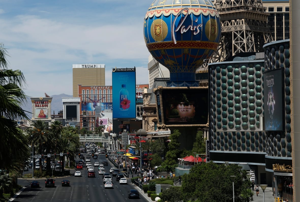 Las Vegas view, with vehicles on the road next to hotels and buildings.