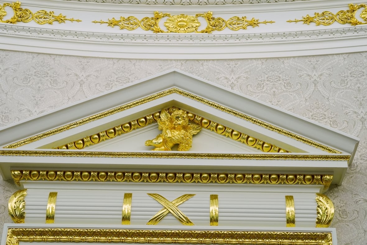 Details of a gold paper over an entrance to the Oval Office and at the crown, you see the White House work, on Tuesday, April 22, 2025, in Washington.