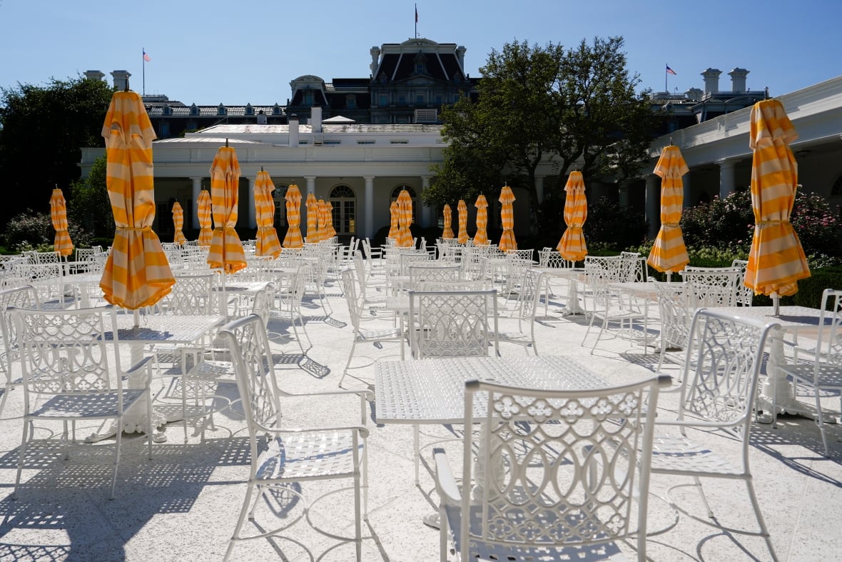 Tables and chairs stand in the newly renewed garden of roses at the White House, on Saturday, August 9, 2025, in Washington.