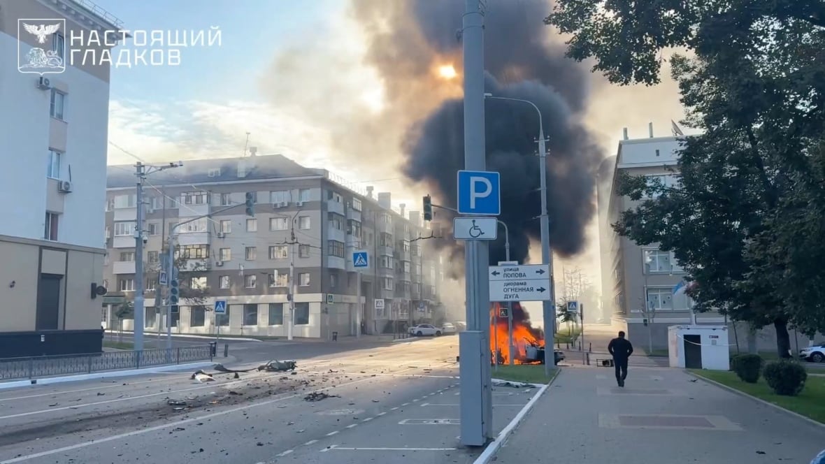 A car is burning after what the local authorities described as a Ukrainian drone attack in the context of Russia-Ukraine's conflict in Beljorod, Russia on August 14, 2025, in this fixed image taken from the video. Governor of Baljuod 