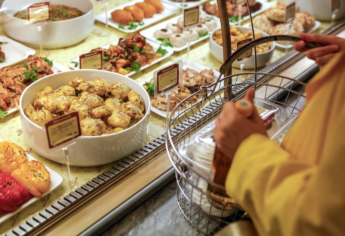 Looking for cooked food on a table in a supermarket in Moscow, Russia on June 26, 2024. 