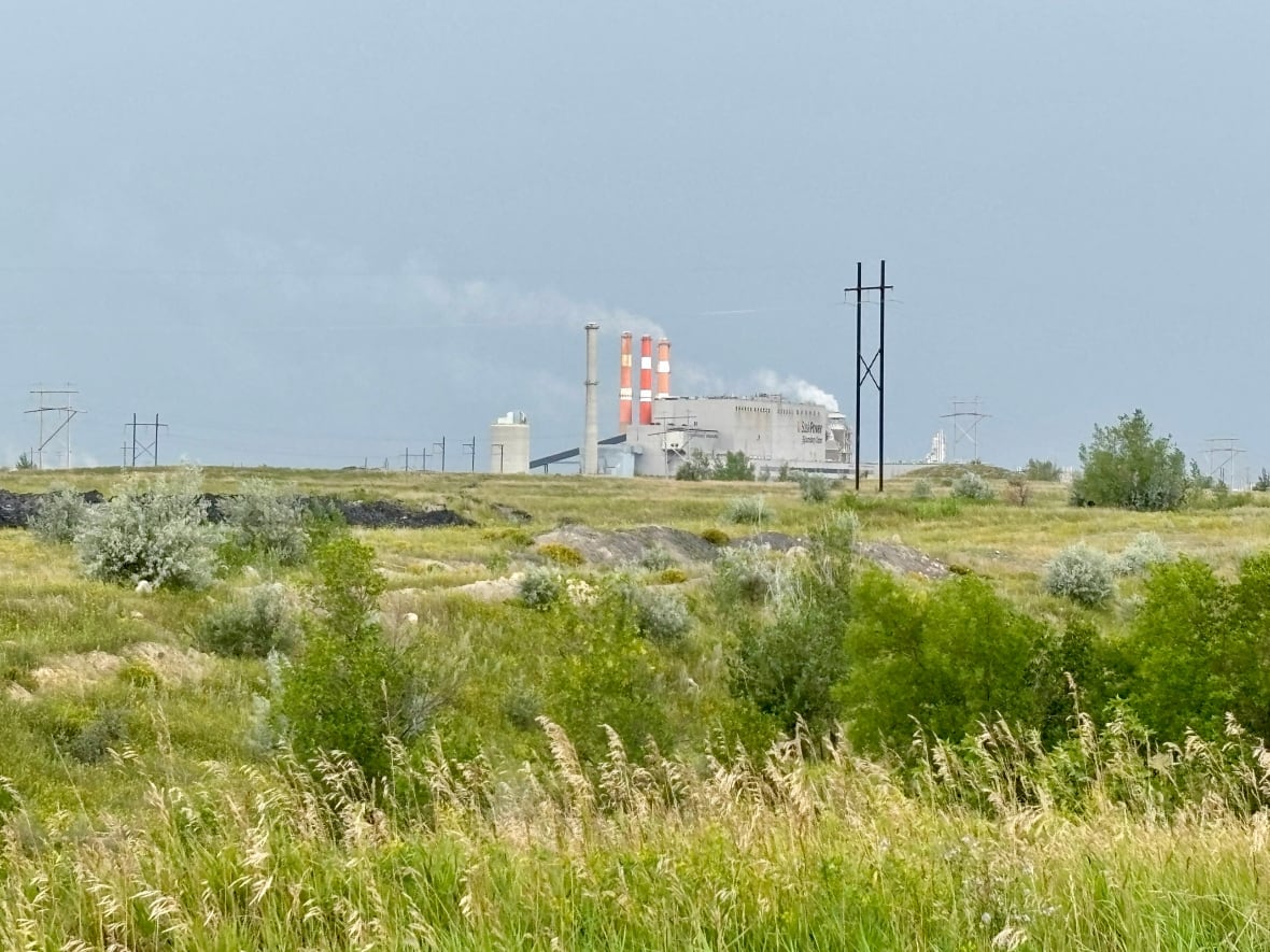 Boundary Dam Power Station pictured off in distance surrounded by Prairie grasslands