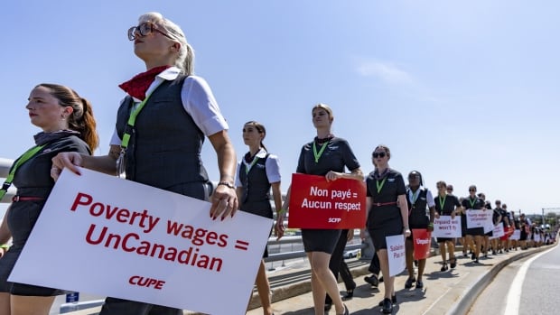 Air canada flight attendants march in montreal on aug 11