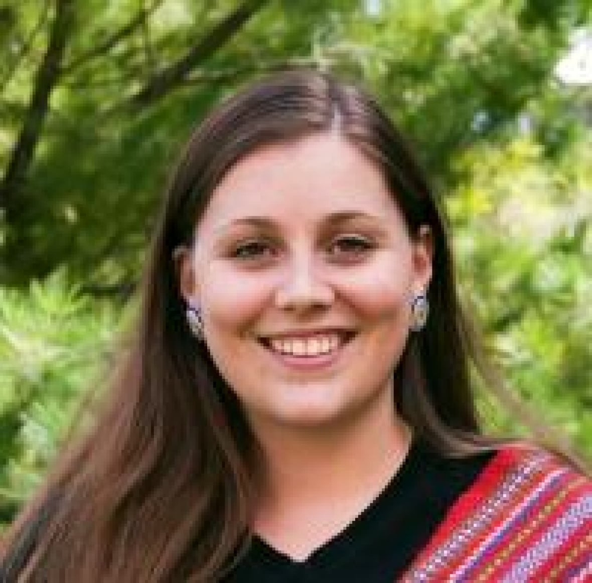 A headshot of Brittany Matthews, the director of reconciliation and strategic policy at the First Nations Child and Family Caring Society.