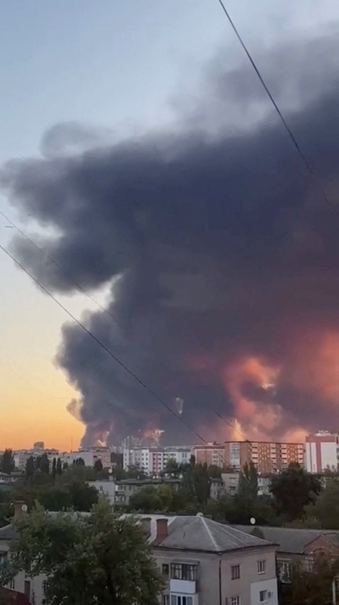Smoke rises after overnight Russian drone and missile strikes on energy facilities in Kremenchuk, Poltava region, during Russia's war in Ukraine, August 19, 2025 in this still image from social media video obtained by REUTERS  