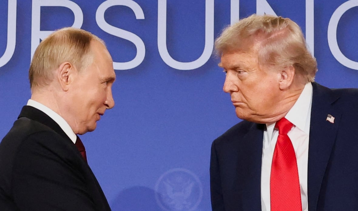 U.S. President Donald Trump and Russian President Vladimir Putin look at each other during a press conference following their meeting to negotiate an end to the war in Ukraine, at Joint Base Elmendorf-Richardson, in Anchorage, Alaska, U.S., August 15, 2025. 