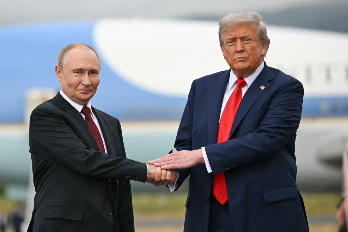 U.S. President Donald Trump greets Russian President Vladimir Putin on the tarmac after they arrived at Joint Base Elmendorf-Richardson in Anchorage, Alaska, on August 15, 2025.