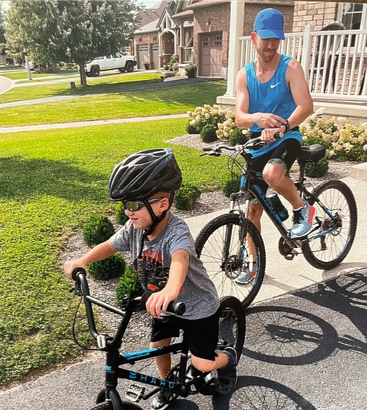 boy on bike with dad on bike