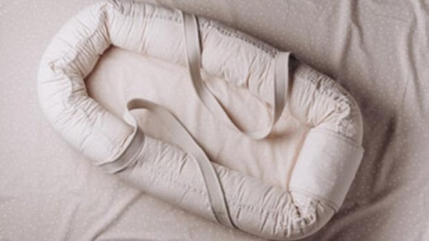 Health Canada recalling several baby loungers, warns of suffocation risks | CBC News