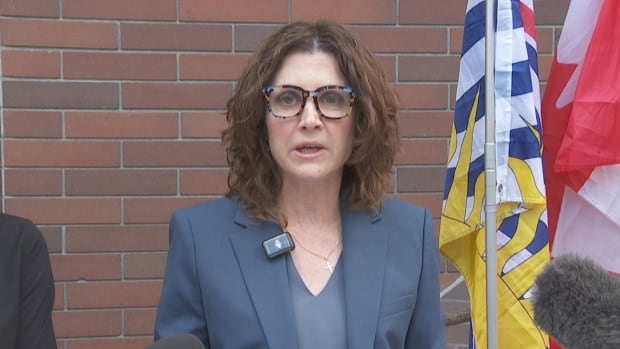 Vancouver-Quilchena MLA Dallas Brodie speaks outside of Vancouver provincial court. woman