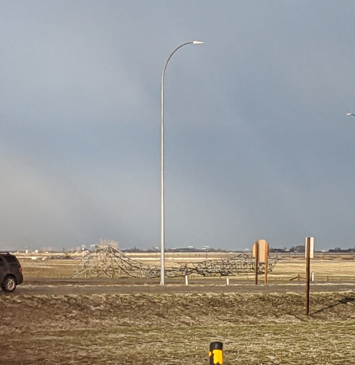 Severe thunderstorm in southern Alberta downs power lines, damages cars