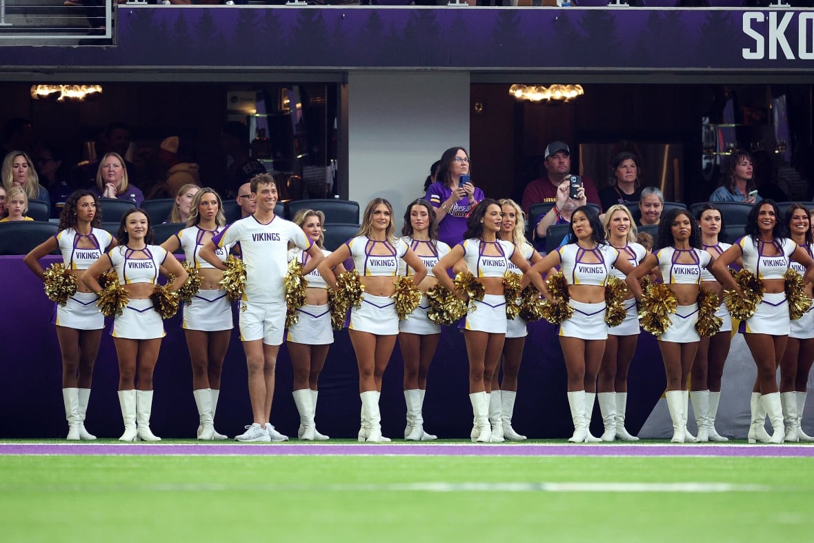 Cheerleaders arrayed in the football wild