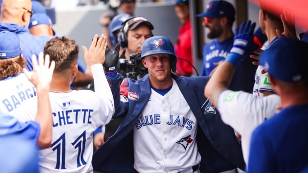 Myles Straw #3 of the Toronto Blue Jays celerbrates a two-run home run in the dugout during the third inning of their MLB game against the Texas Rangers at Rogers Centre on August 16, 2025 in Toronto, Ontario, Canada. Myles Straw of the Toronto Blue Jays celebrates in the dugout at Rogers Centre, after hitting a home run against the Texas Rangers on Aug. 16, 2025.