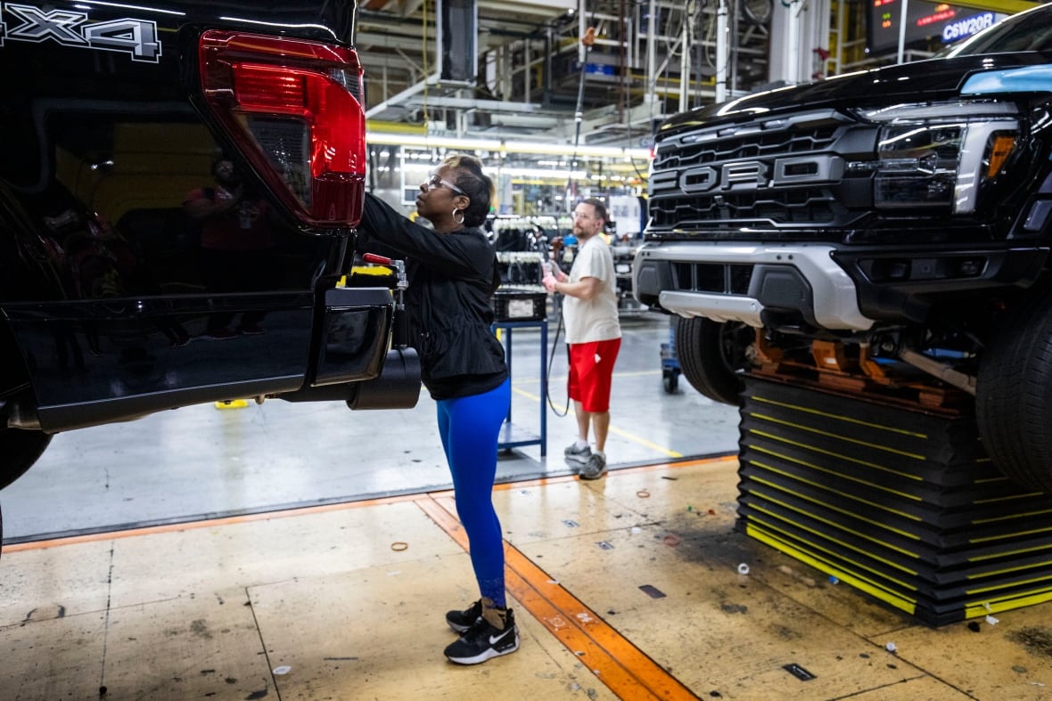 A woman with a blue leedgings and hoodie wearing eyes seeing as he worked in a pickup truck in the Missor Mill in the motorized man who looked. 