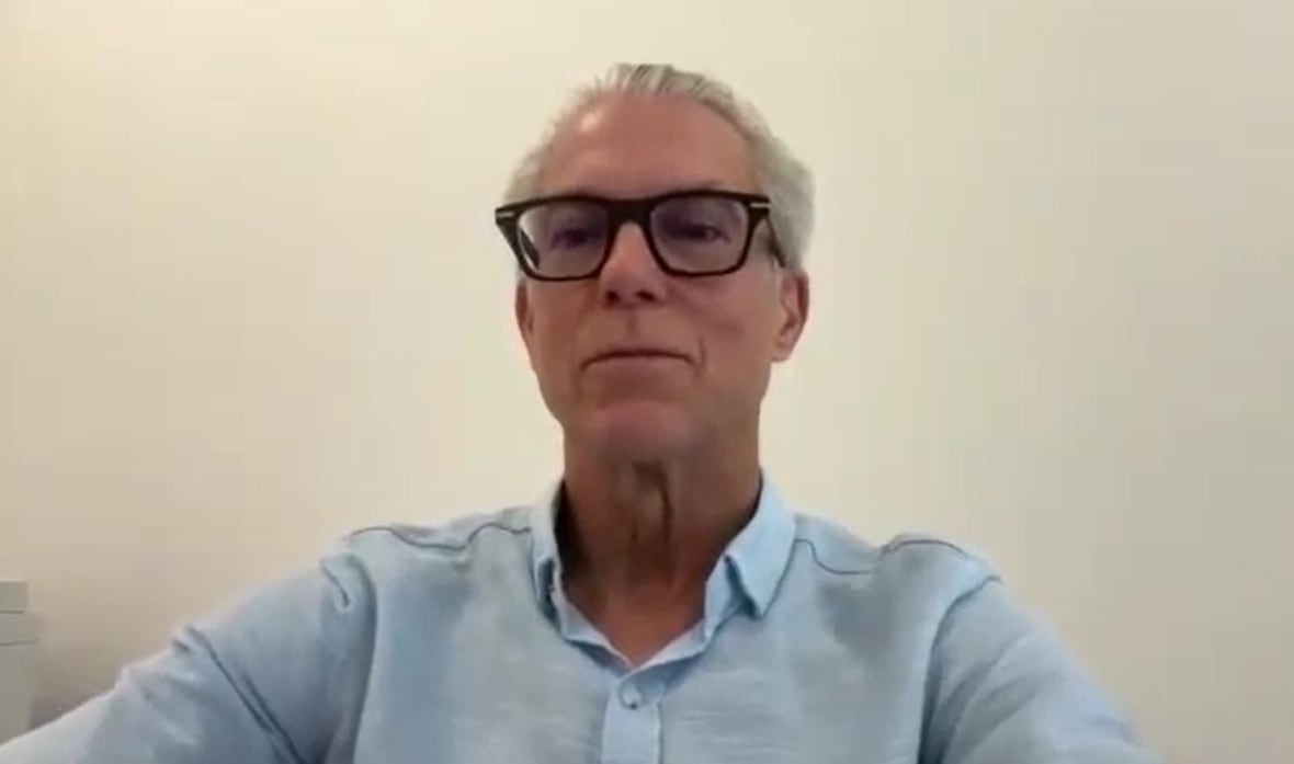 A man speaks on Zoom