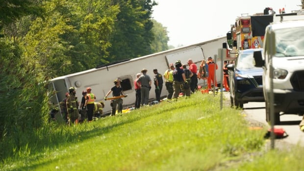 First responders are seen at the site of a deadly bus crash on the New York State Thurway, which occurred near Pembroke, N.Y., on Aug. 22, 2025.