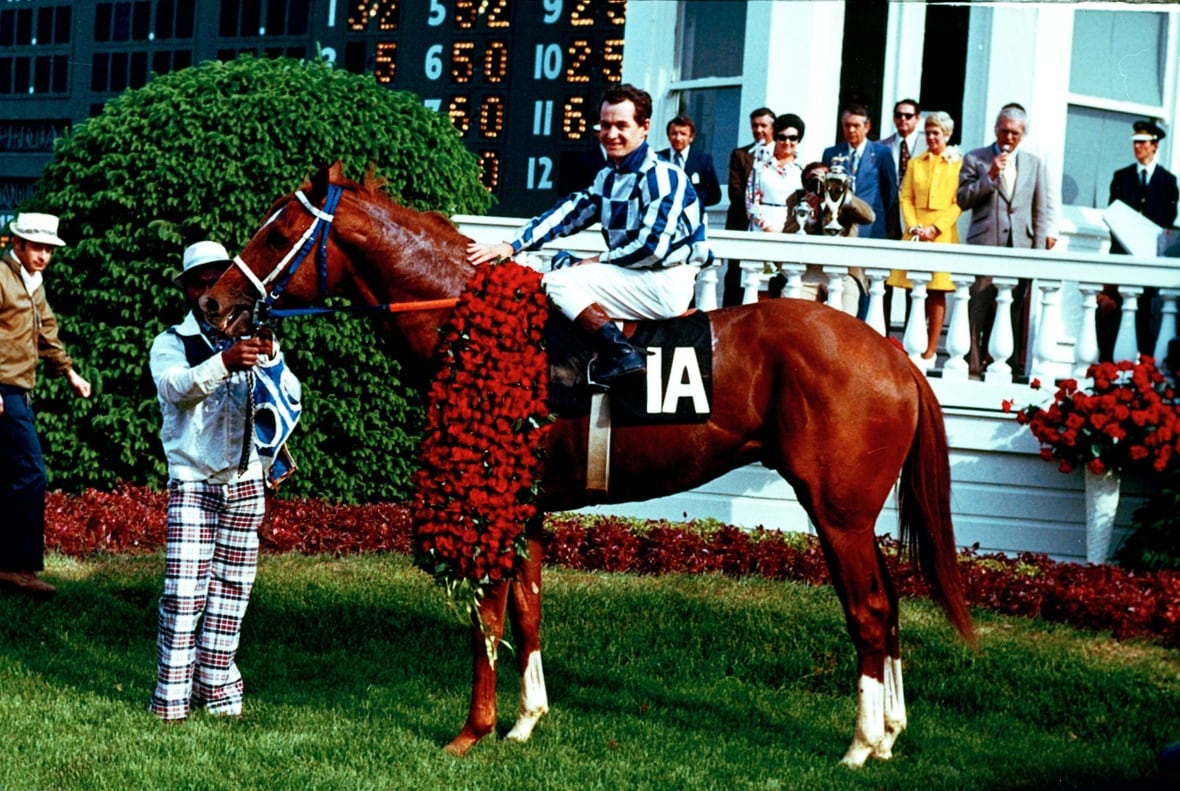 Ron Turcotte poses with his horse Secretariat.