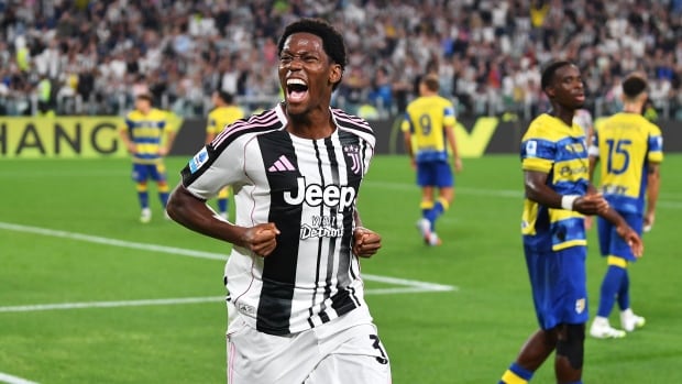 Juventus forward Jonathan David celebrates after scoring during the team's 2-0 victory against Parma in Turin, Italy on Sunday. A men's soccer player celebrates after scoring.