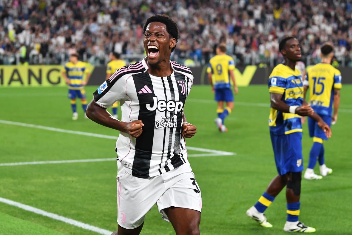 A men's soccer player celebrates after scoring.