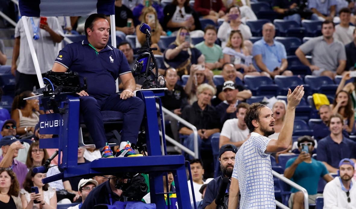 A man talks to judgment in front of a crowd