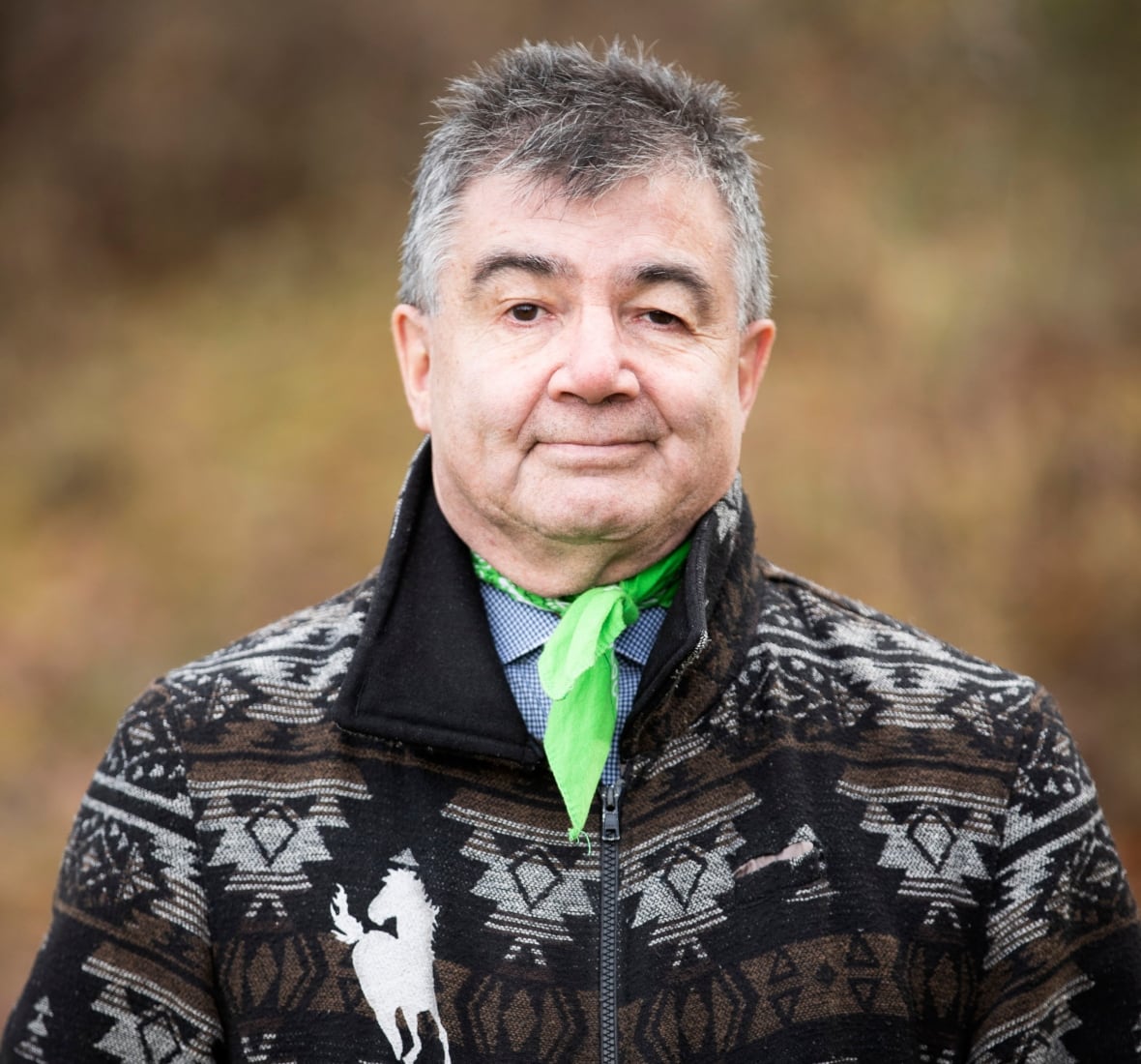 A man looking into the camera for a headshot.