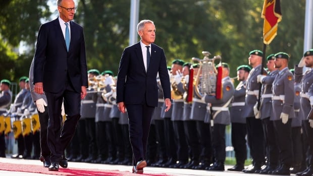 Two men walk together