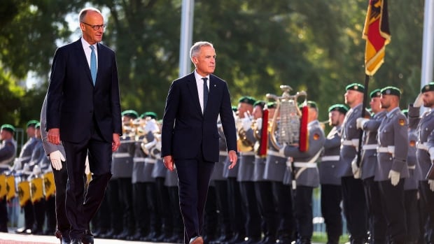 Two men walk together