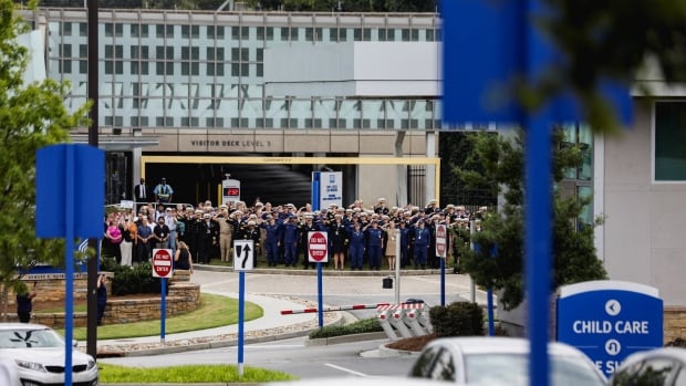 High-ranking CDC members, dressed in uniform, salute senior leaders who resigned from their duties.