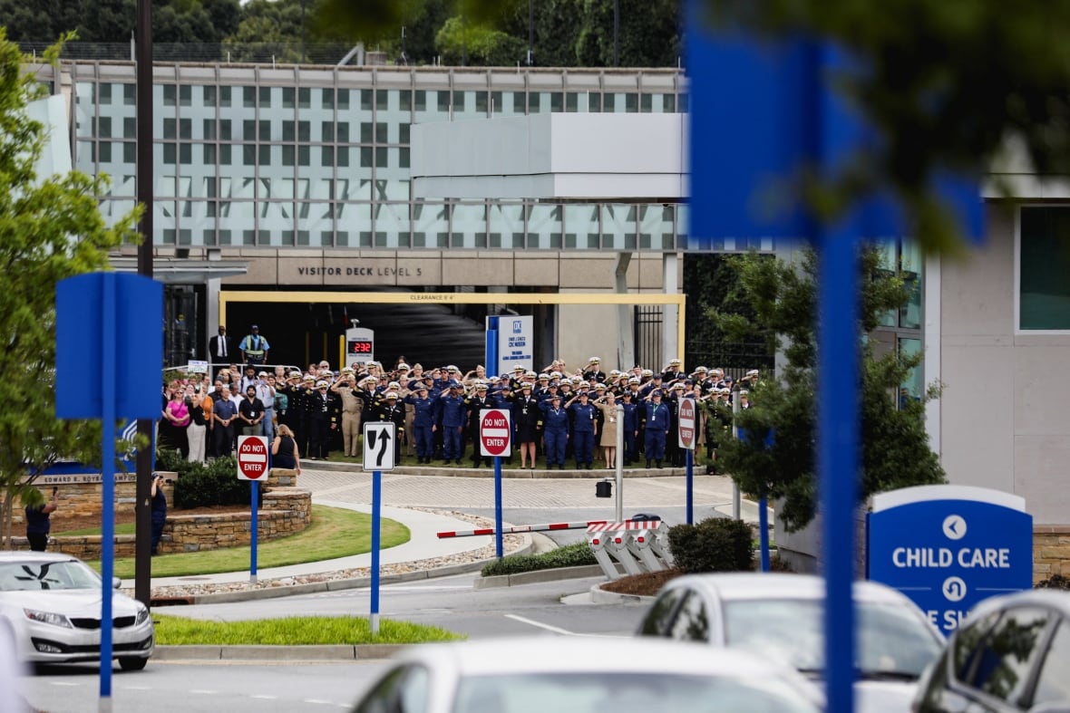 High -level CDC members, who wear uniform clothes, greet the great leaders who resigned from their duties.