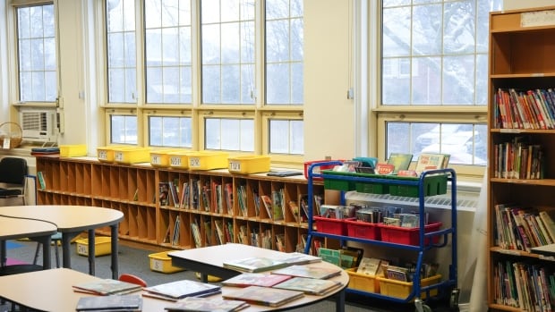 Books are seen on shelves.
