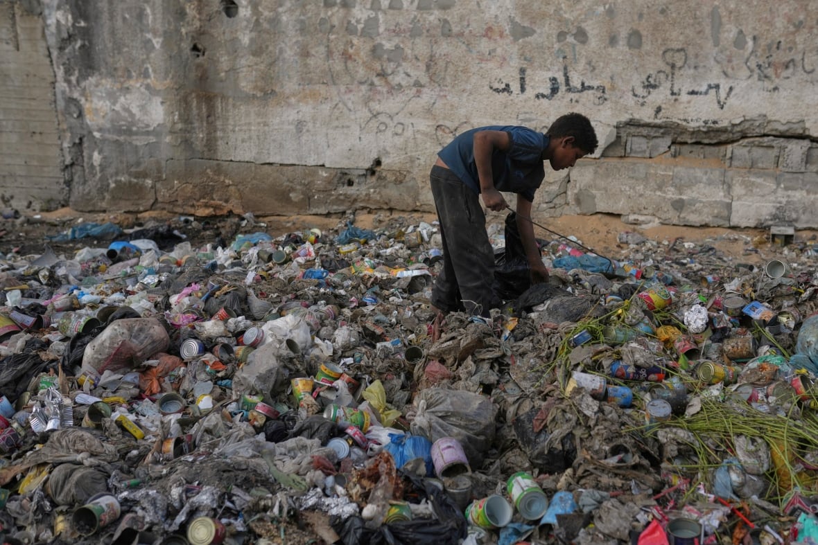 A boy takes off through garbage