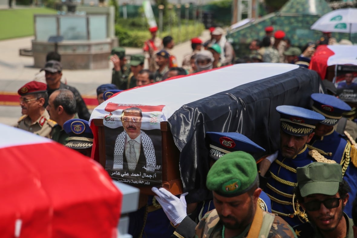 The coffin is carried