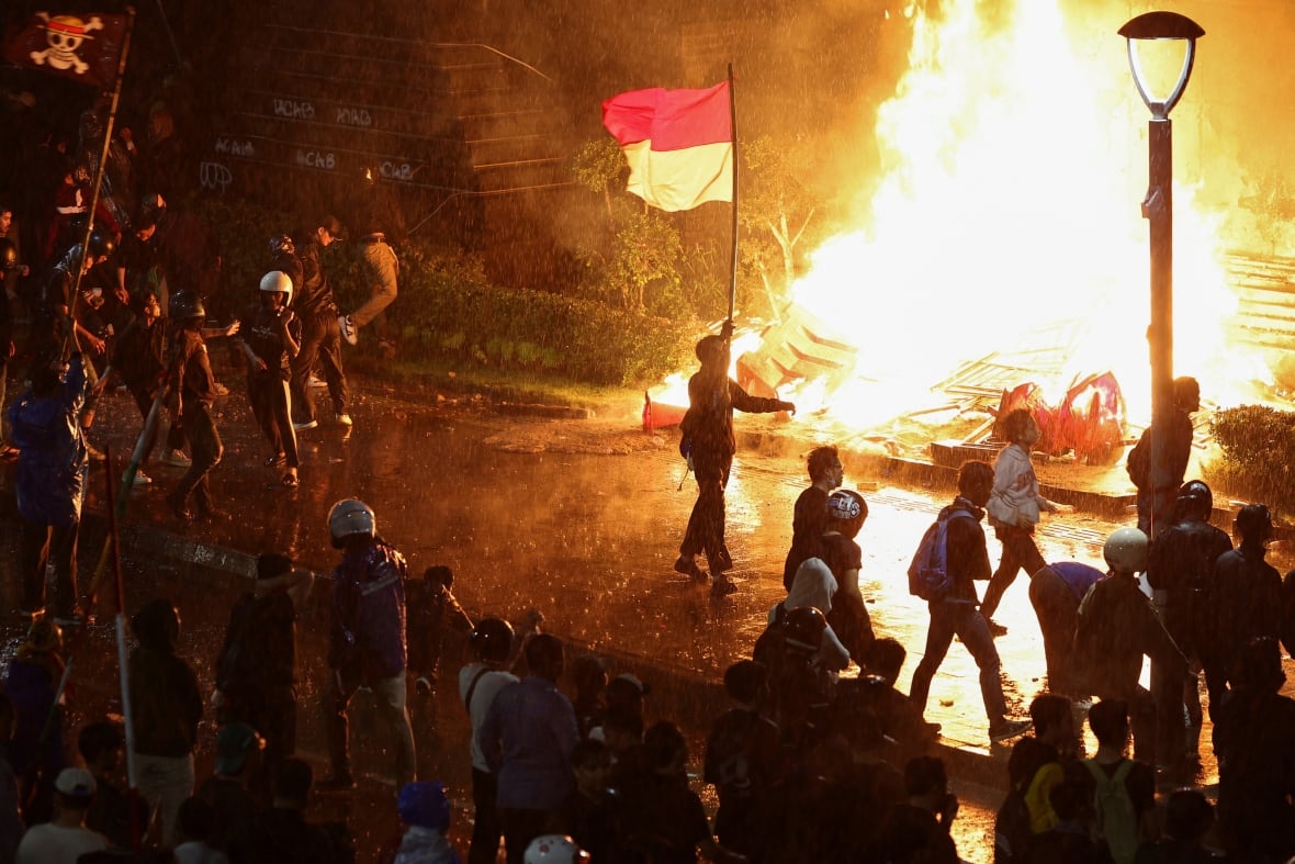 A fire burning while protesting.