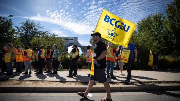 Members of the British Columbia General Employees' Union picket outside a B.C. Liquor Distribution Branch facility, in Delta, B.C., on Monday, August 15, 2022. The BCGEU, which represents approximately 33,000 public-service workers across B.C., issued strike notice last Friday. Members of the British Columbia General Employees' Union picket outside a B.C. Liquor Distribution Branch facility, in Delta, B.C., on Monday, August 15, 2022.