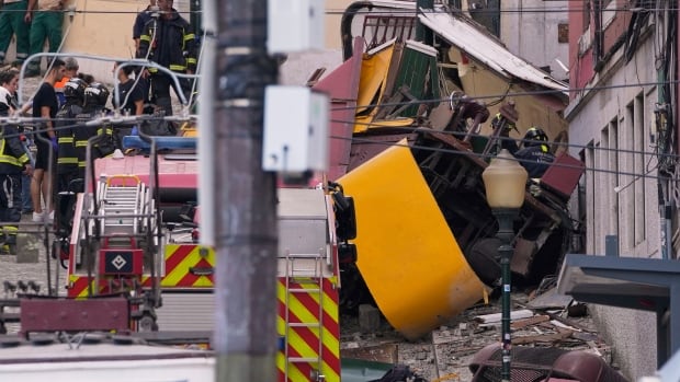 Emergency teams at the scene of a crash involving a funicular in the Portuguese capital of Lisbon.