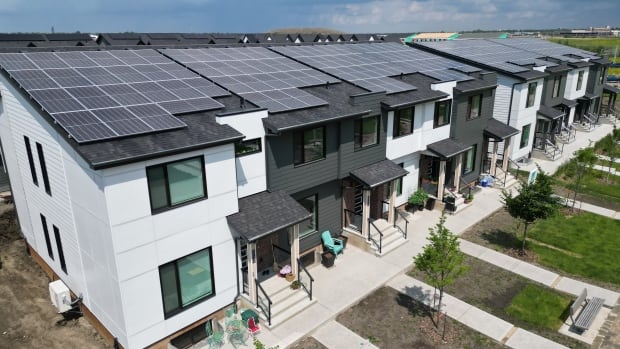 aerial photo of townhomes with solar panels on the roof