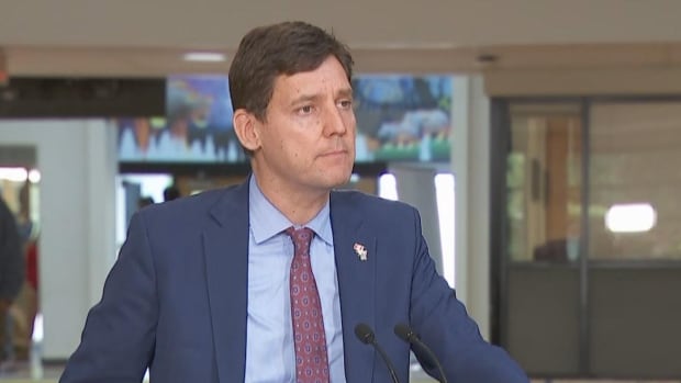 David Eby speaks at a podium