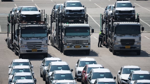 Car carriers transporting vehicles made by Kia Motors, which is part of South Korea's biggest automaker company Hyundai Motor, are parked at Pyeongtaek port in Pyeongtaek, South Korea, April 15, 2025.  