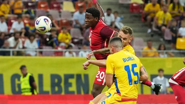 A soccer player scores.