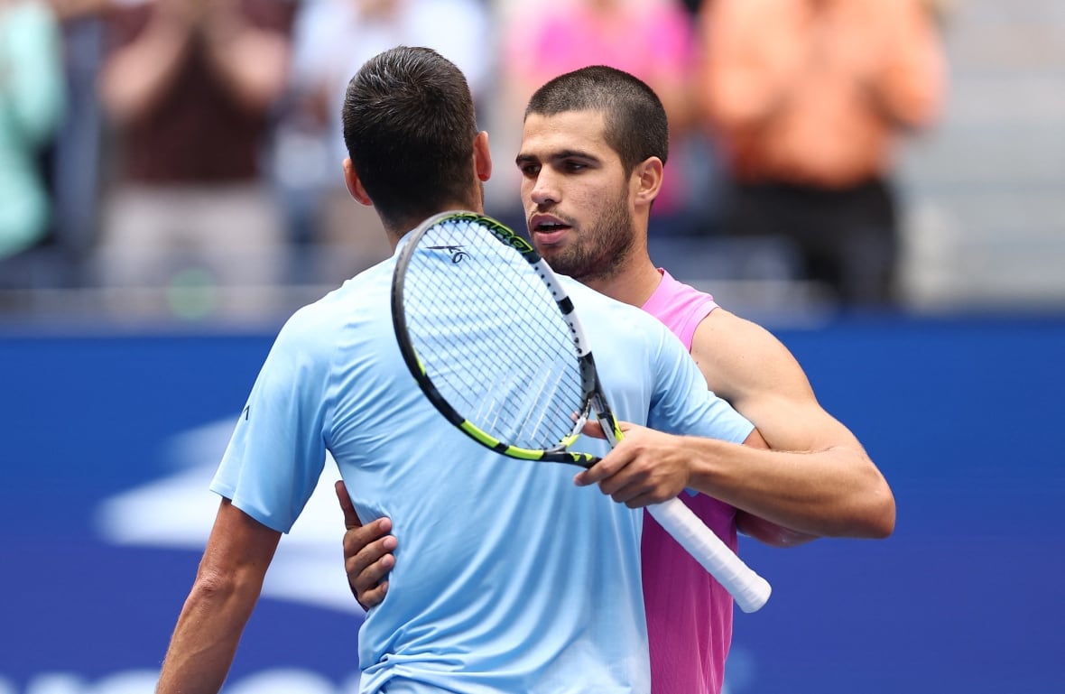 Two male tennis players.