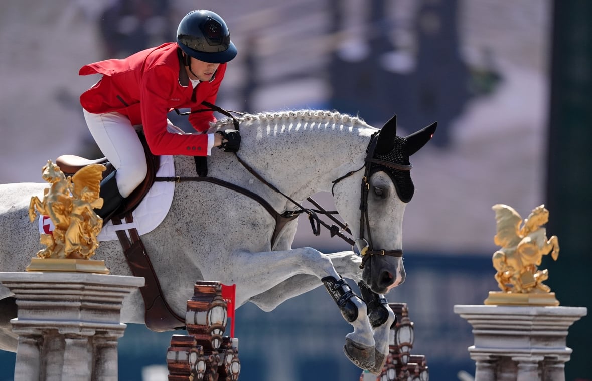 Martin Fuchs, aboard Leone Jei, competing in the final equestrian jumping during the Summer Games in Paris 2024 in Château de Versailles.