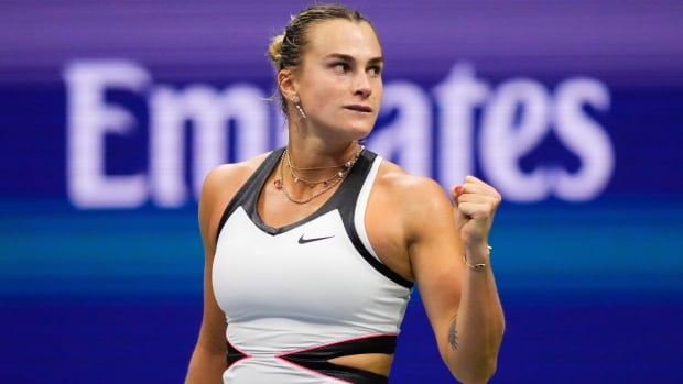 Aryna Sabalenka of Belarus reacts while playing Amanda Anisimova of the United States in the U.S. Open women's final on Saturday in New York City. A female tennis player pumps her left fist in celebration.