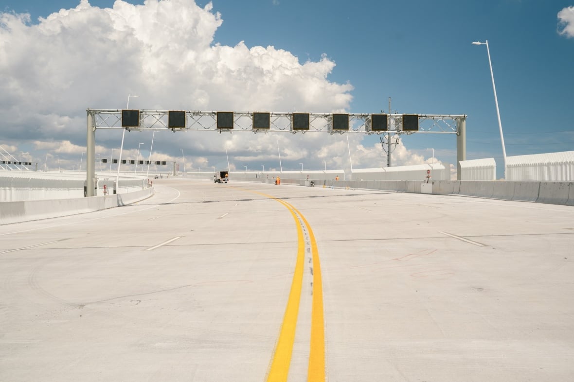 View from the deck of the Gordie Howe International Bridge as traffic lines and markings are being painted.