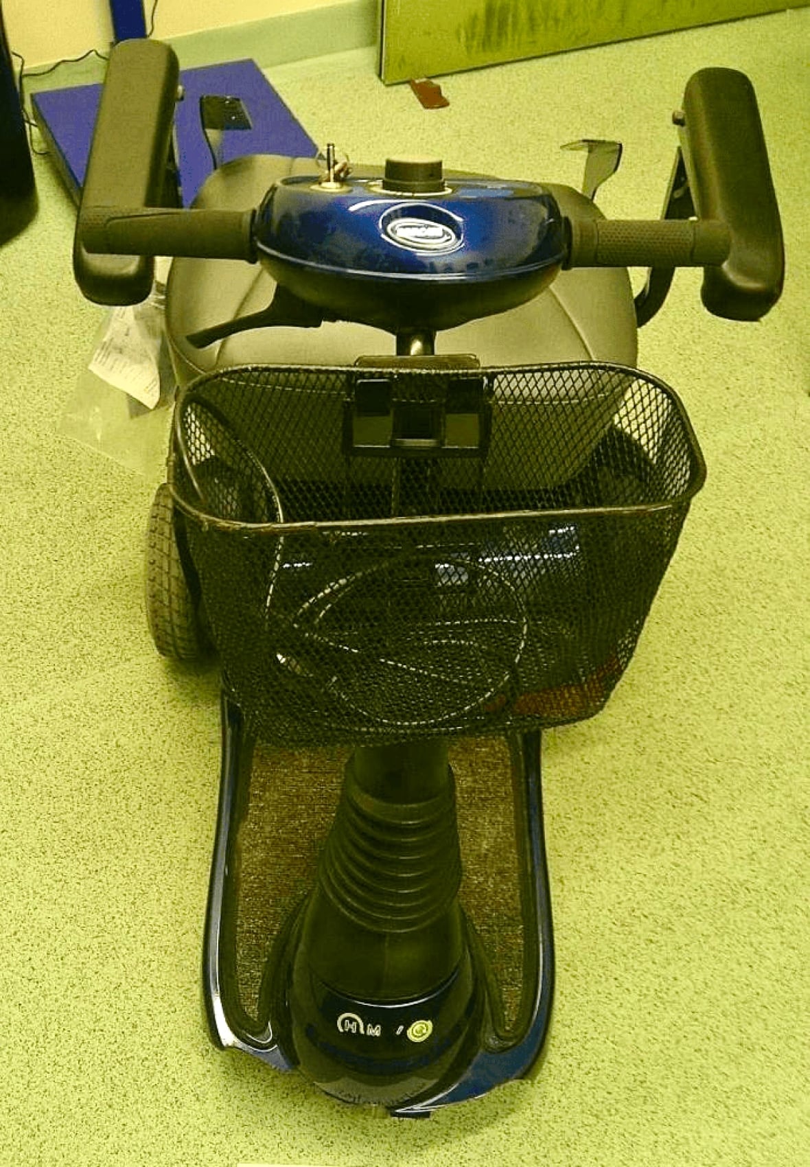 A mobility scooter, photographed from the top.